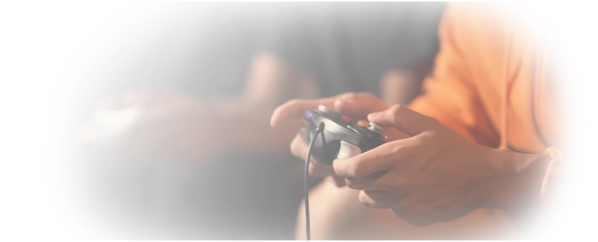 Human hand holding a gamepad during videogame session